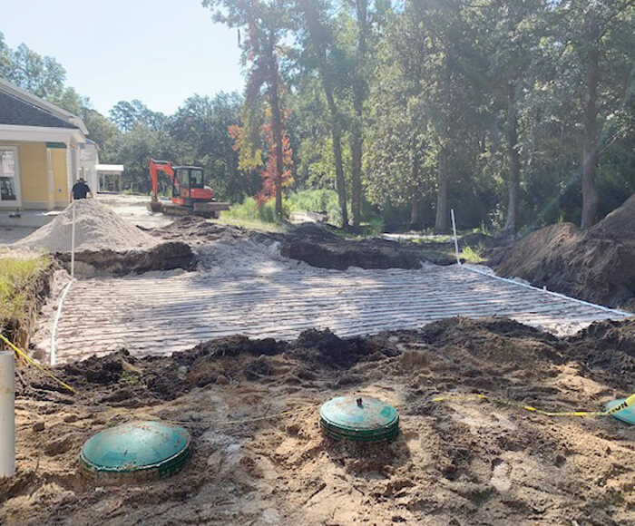 Performing septic tank pumping